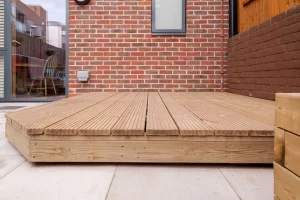 A newly built wooden deck in a back garden, illustrating the quality of deck builders' work.